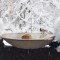 Heated bird bath on a snowy railing