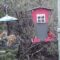 Brown thrasher and cardinal at feeders.